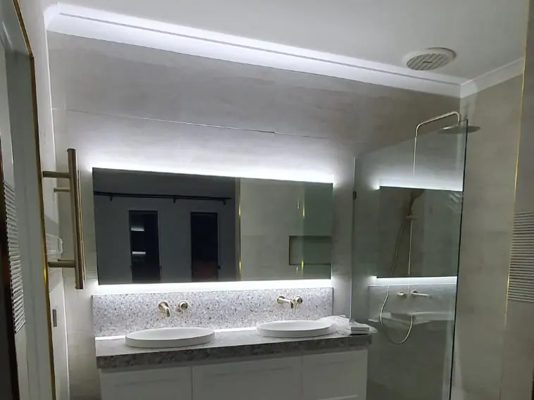 Bathroom with LED mirror and feature lighting