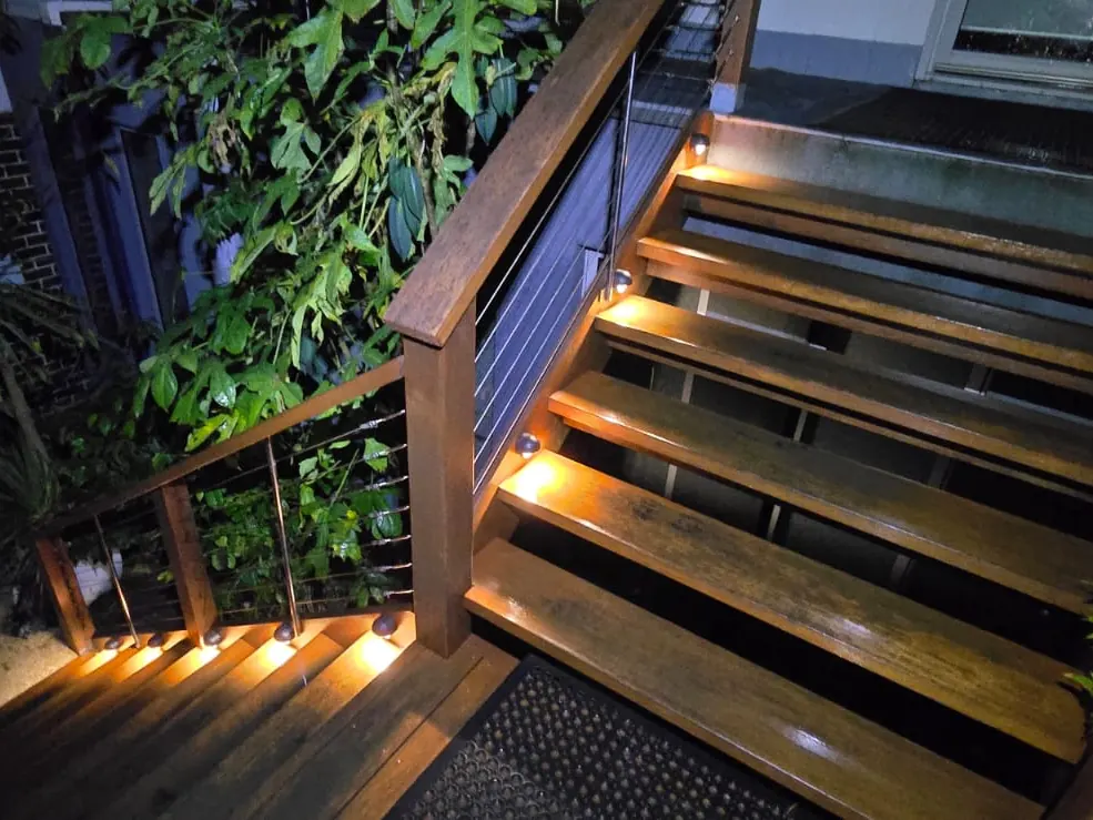 LED step lights installed on timber deck stairs