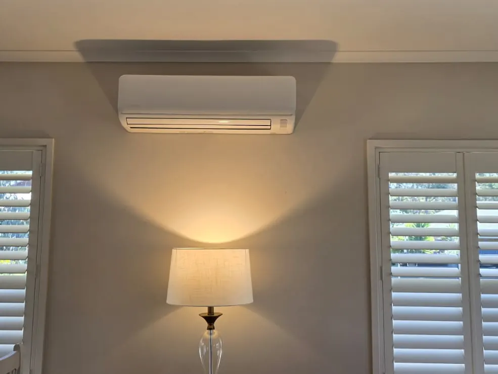 Split system air conditioner installed in a living room