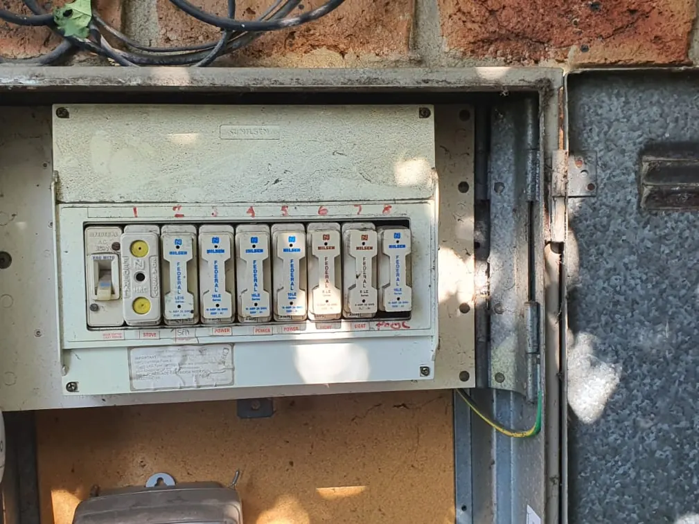 Old ceramic fuse board before a Smart Link Electrical switchboard upgrade